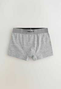 Boxer shorts en coton gris avec une ceinture élastique noire, arborant le nom de la marque "NEXT" tricoté en noir. Texture douce et design ajusté.