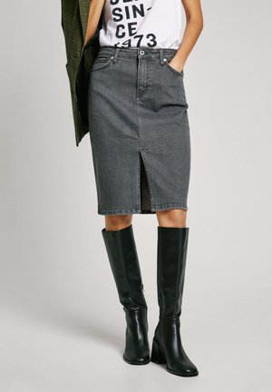 Gray denim pencil skirt with front slit, five-pocket design, and belt loops, paired with black knee-high block-heeled boots.