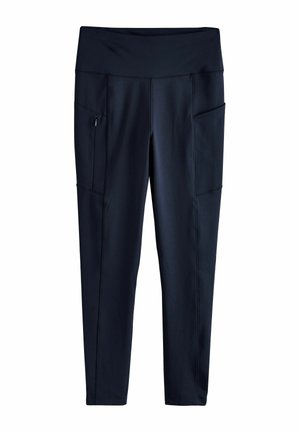 Námořnické modré sportovní legíny s širokým pasem, dvěma bočními kapsami a švy. Vyrobené z pružného a hladkého materiálu.