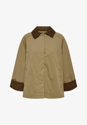 Bēša īsā mētelis ar tumši brūnu korduroja apkakli un aprocēm, priekšējās kabatas un slēgtu pogu aizdari.