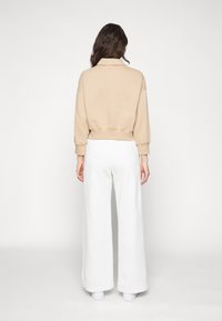 Nike Sportswear W NSW STYLE FLC CROP 3Q POLO - Camisola - beige