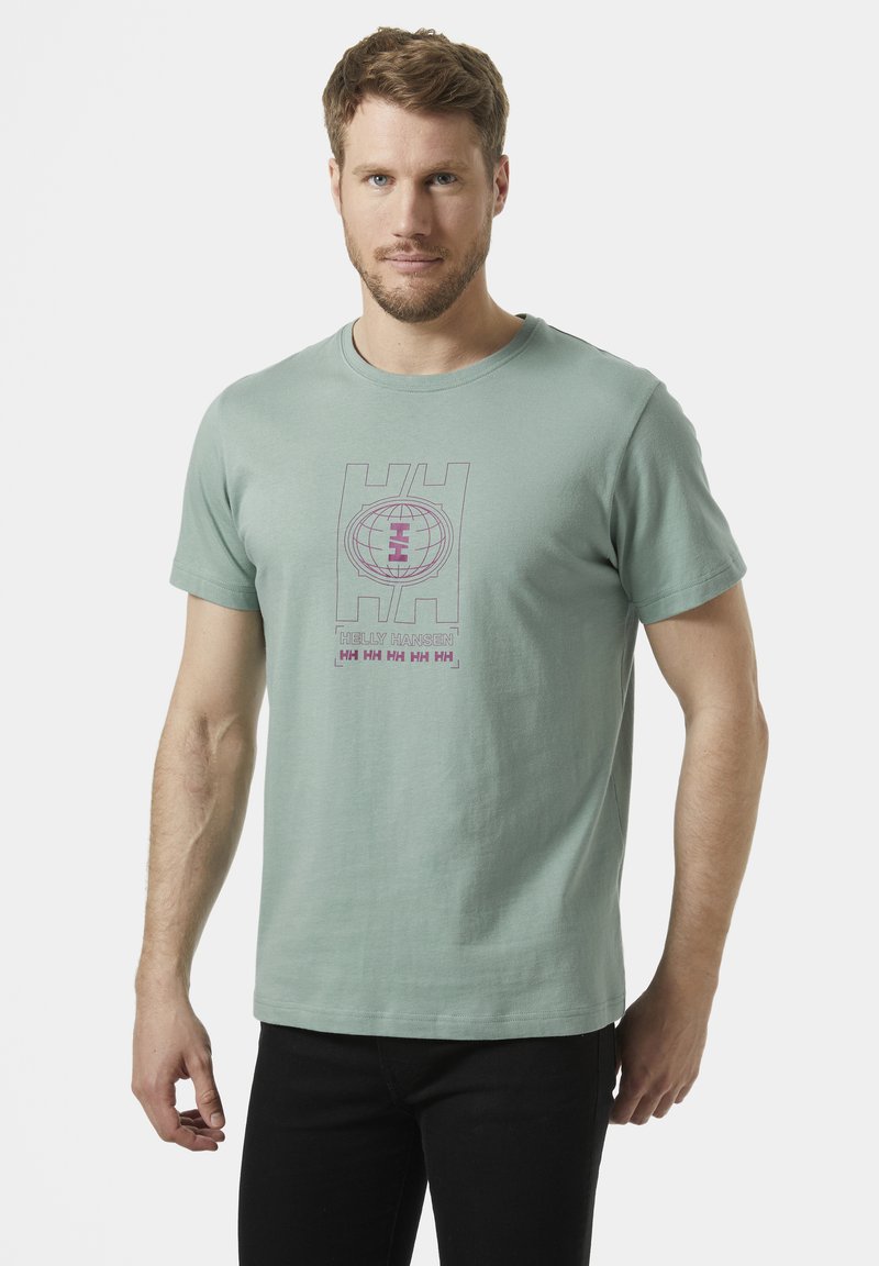 Lichtgroene katoenen t-shirt met een paarse grafische logo-ontwerp op de voorkant. Korte mouwen en een ronde halslijn, casual pasvorm.