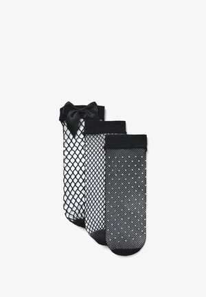 Set di collant neri composto da tre stili: uno a rete con fiocco in satin, uno a tinta unita e uno a pois, tutti con bordi elasticizzati.