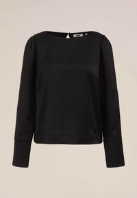 Blusa nera a maniche lunghe con colletto rotondo, tessuto texturizzato e sottili strisce verticali. Presenta una chiusura con bottoni sul retro e una vestibilità tailored.