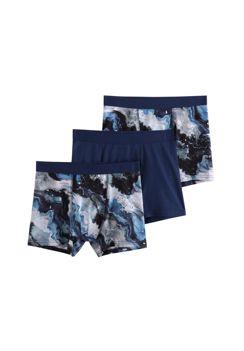 Three pairs of boxer briefs: one solid navy, two with a blue, black, and white marble pattern. Made from soft, stretchy fabric.