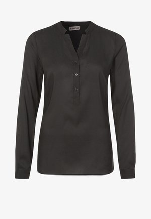 Musta pitkähihaisuus paita, jossa on mandariinikaulus ja napitettava etuosa. Silkkinen kangas, jossa on hieman kiiltoa; sisältää pieniä pyöreitä nappeja.