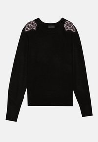 Pull noir en maille avec manches longues, encolure ronde et ornements scintillants sur les épaules. Texture lisse, coupe courte.