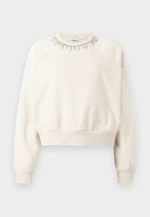 Kreemivärvi sweatshirt, millel on õlavarred, soonikkoes varrukad ja alläär ning dekoratiivne helmeste kaelus, mis sisaldab kristalle ja pärleid.
