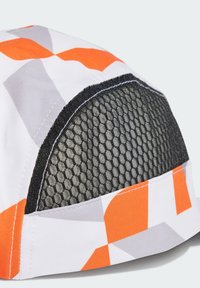 Multicolored cap featuring orange, gray, and white geometric patterns, with a textured black mesh panel for ventilation.