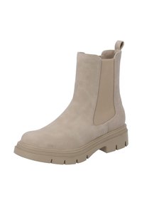 Botín beige hasta el tobillo con parte superior sintética texturizada, paneles laterales elásticos y una suela de goma gruesa con surcos profundos para mayor tracción.