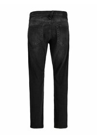 Črne jeans hlače iz jeansa, prikazane od zadaj z dvema zadnjima žepoma, zankami za pas in ozkim ravnim krojem.