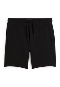 Shorts décontractés noirs avec une taille élastique et un cordon noir, fabriqués en tissu doux, présentés à plat sur fond blanc.