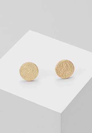 Boucles d'oreilles circulaires en or avec une surface texturée, présentant des lignes et des motifs entrecroisés. Bords lisses et finition polie.