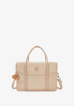 Beige fabric bag with a textured finish, twin handles, removable shoulder strap, and a keychain accessory resembling a teddy bear.