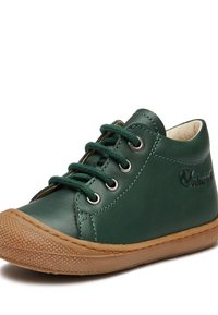 Gröna läder sneakers med rund tå, plana snören, metallöglor och texturerad gummisula. Har logotypdetalj på sidan.
