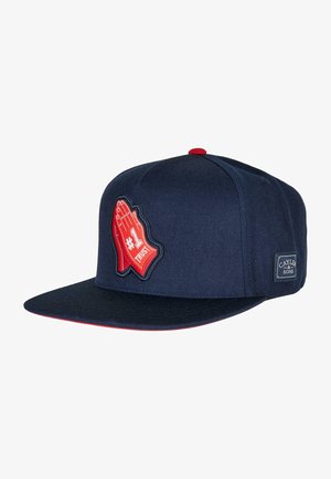 Marineblaues Cap mit flachem Schirm, gekennzeichnet durch eine rote Handgrafik und den Text "#1 TRUST". Hergestellt aus strukturiertem Stoff, mit Logo-Patch an der Seite.