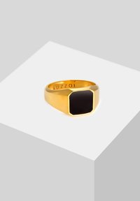 Gold-toned metal ring with a rectangular black stone, featuring a smooth texture and a beveled edge. Engraved with "Kuzzoi" inside.