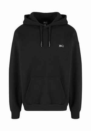 Black hooded sweatshirt made of cotton, featuring a front pocket, ribbed cuffs, and a small logo on the chest. Soft texture, casual design.