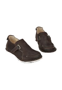 Brown leather slip-on shoes with a smooth texture, contrasting white stitching, and a side strap with a metal buckle.