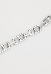Metal chain with rectangular links, polished silver finish, featuring a smooth texture and uniform shape throughout.