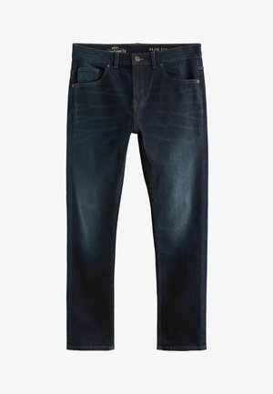 Soehva tumesinine teksapüksi, millel on veidi kulunud viimistlus, viie tasku ja kontrastõmblused. Õmblustes tugevdusõmblus.