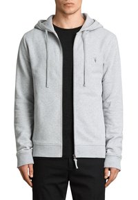 Felpa grigia con zip realizzata in materiale morbido, con cerniera frontale, cappuccio con lacci e dettagli neri sotto.