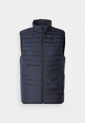 Gilet matelassé bleu marine avec col montant, fermeture éclair à l'avant et coutures horizontales. Comprend des poches latérales et un logo de marque sur la poitrine. Conception légère.