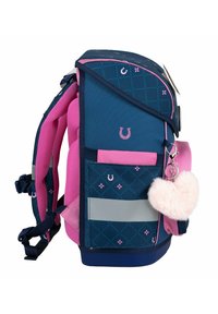 Blue and pink backpack featuring a geometric pattern, reflective strip, padded straps, and a fluffy heart keychain accessory.