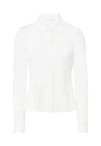 Camicia bianca a maniche lunghe con colletto classico, tessuto liscio e chiusura frontale con bottoni. Senza fantasie o decorazioni.