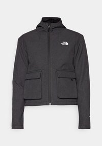 Veste noire à fermeture éclair à l'avant avec capuche, dotée de deux poches plaquées avant, d'un tissu texturé et d'un petit logo blanc sur le côté gauche supérieur.