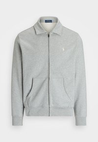 Šedá mikina na zip s límečkem, dvěma předními kapsami a malým vyšívaným logem na levé straně. Vyrobena z měkké látky.