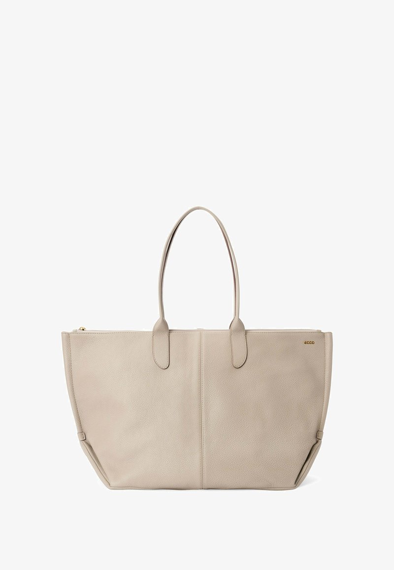 Beige læder tote taske med dobbelte håndtag. Tekstureret overflade, struktureret facon og guld lynlåsdetalje. Minimalistisk design uden synlige logoer.