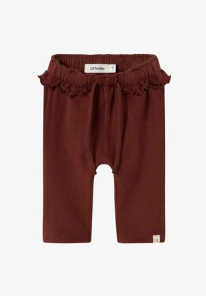 Bruine gebreide babybroek met elastische tailleband, franje-detail en merklabel "Lil' Atelier" op de achterkant. Maat 1-2 maanden.