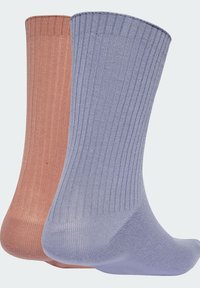 Two pairs of ribbed socks: one in soft peach and the other in pastel blue, showcasing a breathable texture and comfortable shape.
