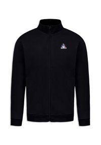 Giacca nera con zip realizzata in materiale morbido. Presenta un colletto alto, due tasche laterali e un piccolo logo sul petto.