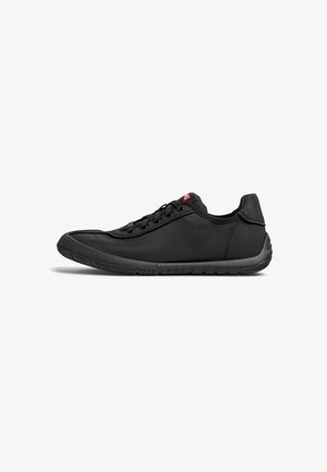 Black athletic shoes with a smooth fabric upper, rubber sole, six eyelets for laces, and a rounded toe design.