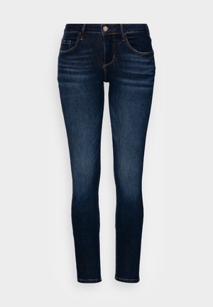 Donkerblauwe slim-fit jeans met lichte vervaging op de dijen, zichtbare stiksels, een frontknop, rits en vijf-pocket ontwerp.