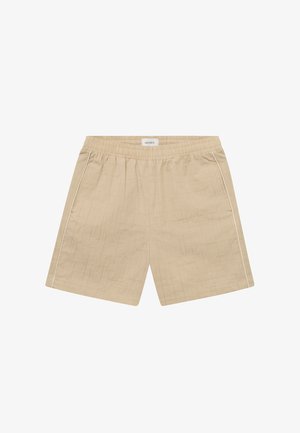 Beige shorts med elastisk midje, med en teksturert overflate og hvite sidestriper. Laget av lett stoff.