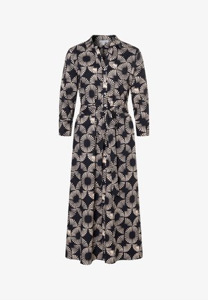 Knopfverschluss, langärmliges Kleid aus Stoff mit marineblauem Hintergrund und cremefarbenen kreisförmigen sowie sternförmigen Mustern. Inklusive Gürtel.