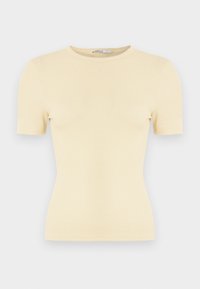 T-shirt jaune pâle côtelé à manches courtes avec un col rond et une coupe ajustée, présentant une texture douce et un design minimaliste.