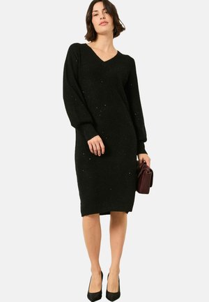 Schwarzes gestricktes Kleid mit V-Ausschnitt, langen Ärmeln und taillierter Silhouette. Hat dezente Glitzerpartikel und gerippte Bündchen an den Ärmeln sowie am Saum.