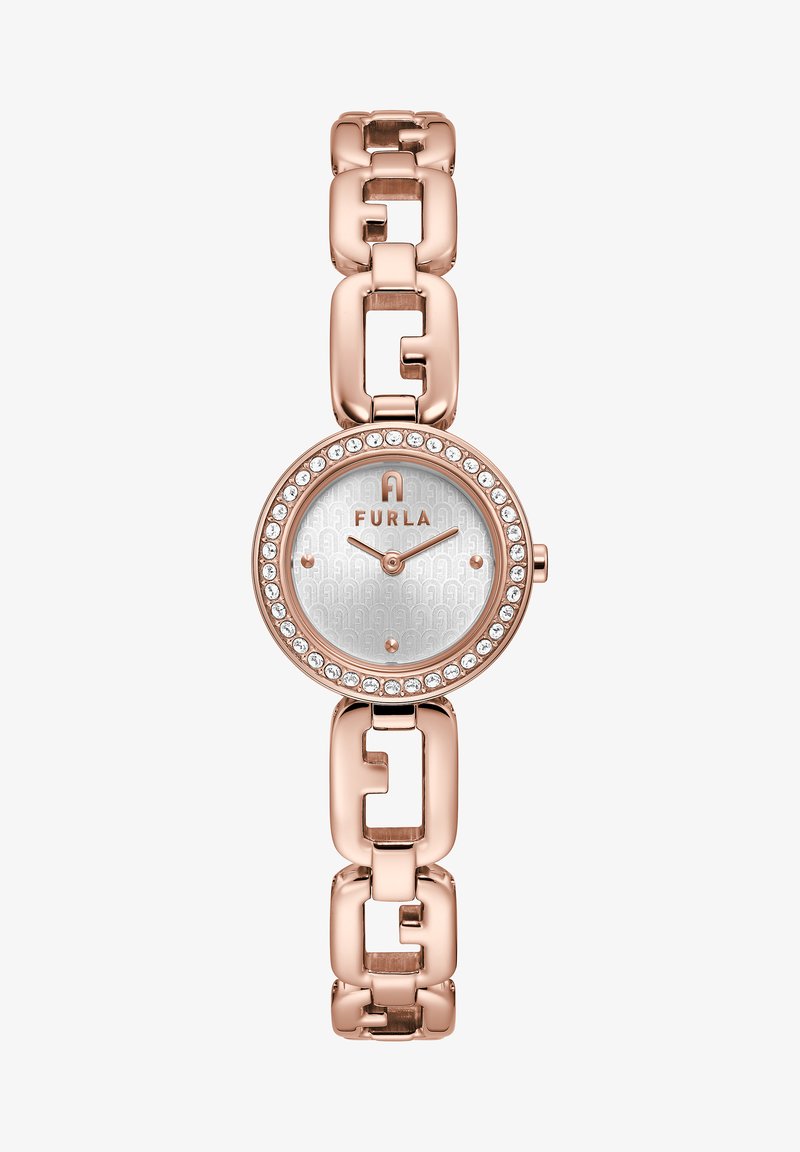 Furla kellaga, millel on roosa kuldne metallist lingikett, ümmargune korpus, hõbedase mustriga kellanäitur, kristallaktsendid ja logo keskel.