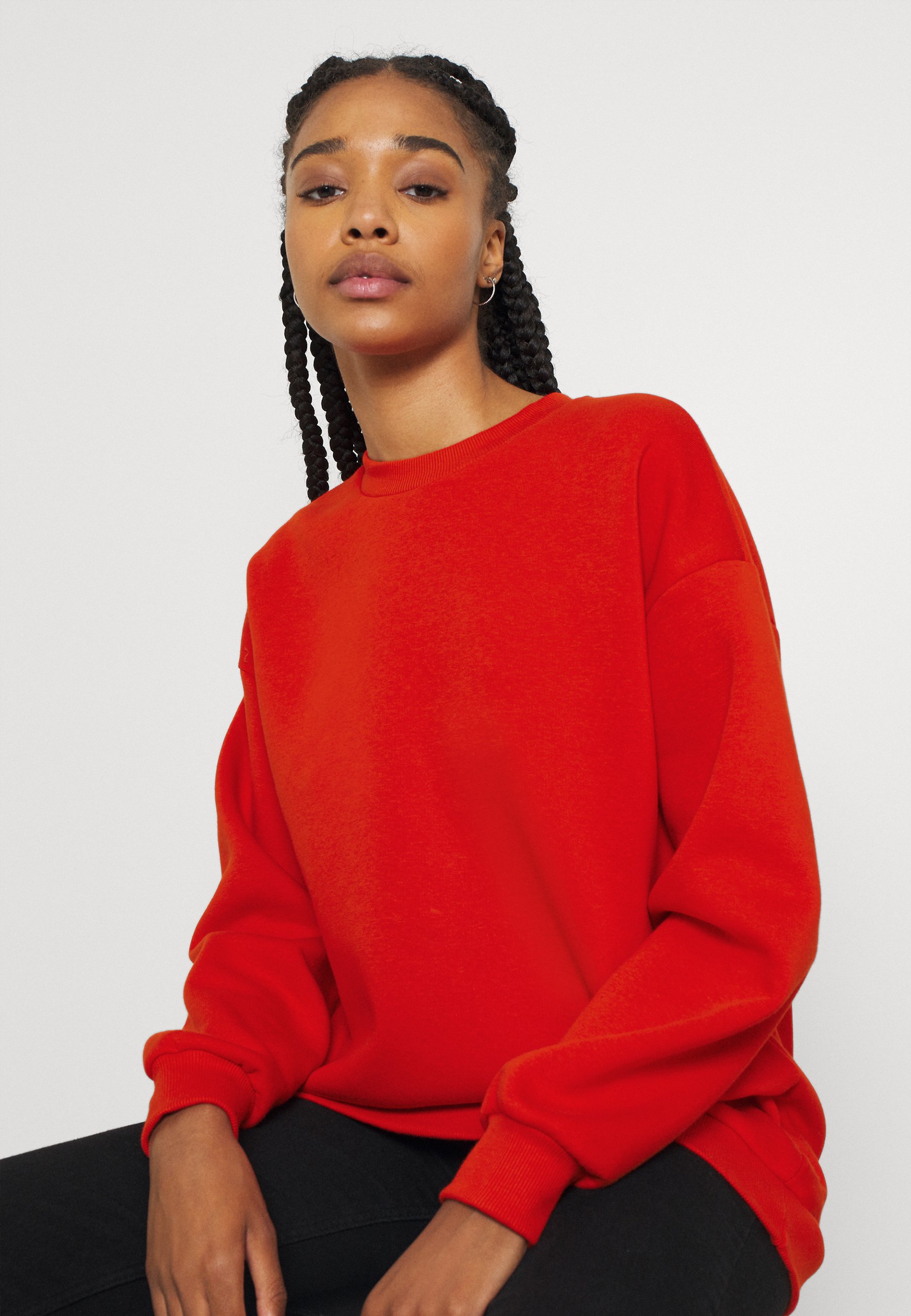 red oversized sweatshirt