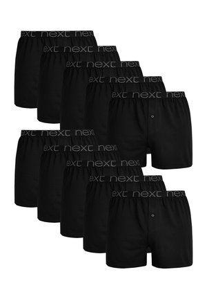 Schwarze Boxershorts aus Baumwolle, mit einem elastischen Bund, auf dem "next" in Grau gedruckt ist. Sieben Paare in einer Reihe angeordnet.