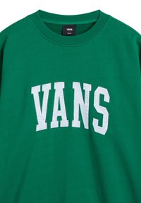 Felpa verde girocollo realizzata in misto cotone, con grande scritta bianca "VANS" sul petto, caratterizzata da una texture liscia.
