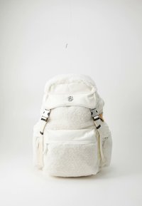 White backpack with plush, textured fleece on the body. Features front pockets, adjustable straps, and silver hardware accents.