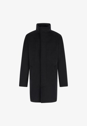 Black, long coat with a high collar, made of a soft fabric. Features side pockets, straight silhouette, and minimalistic design.