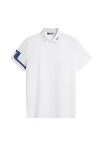 Vit polo-skjorta i mjukt tyg med krage, tre knappar och marinblå accent på vänster ärm med ett logomönster.