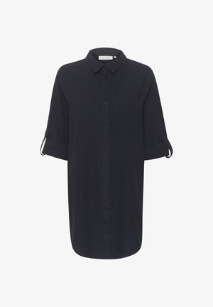 Svart skjortekjole med knapper, oppbrettede ermer, en brystlomme foran og klassisk krage.