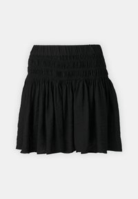 Μαύρη κοντή φούστα με σμιγκέ παντελόνι, που διαθέτει επίπεδο σχέδιο και ελαφρύ ύφασμα. Χωρίς ορατά μοτίβα ή διακοσμήσεις.